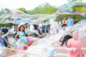 Children playing with bubbles. 