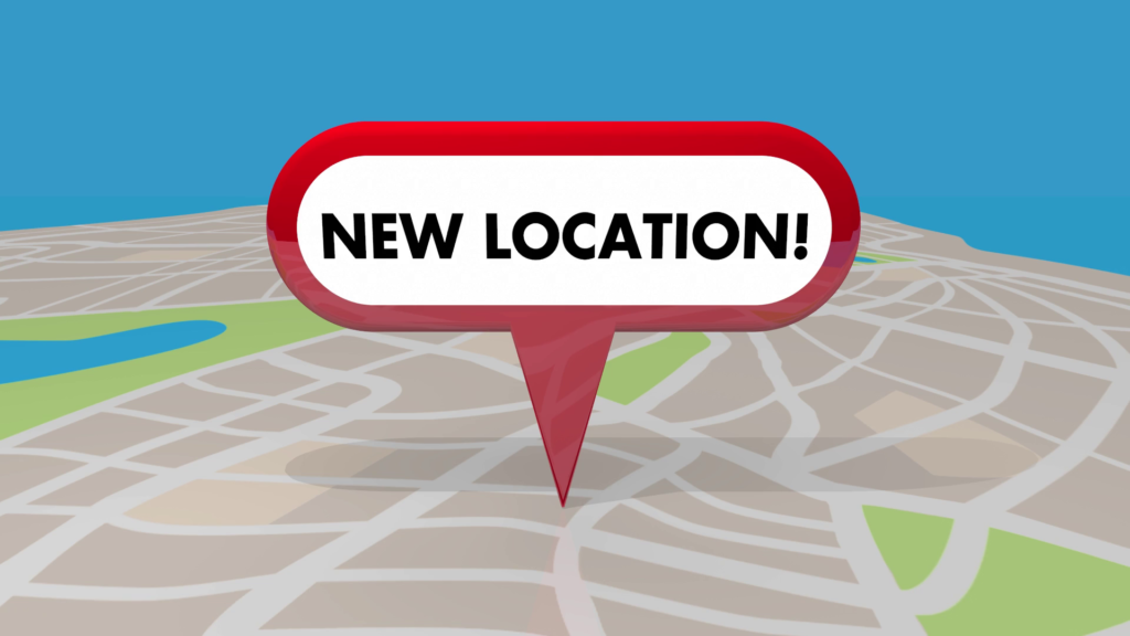 Image of a map with a pin that says new location.