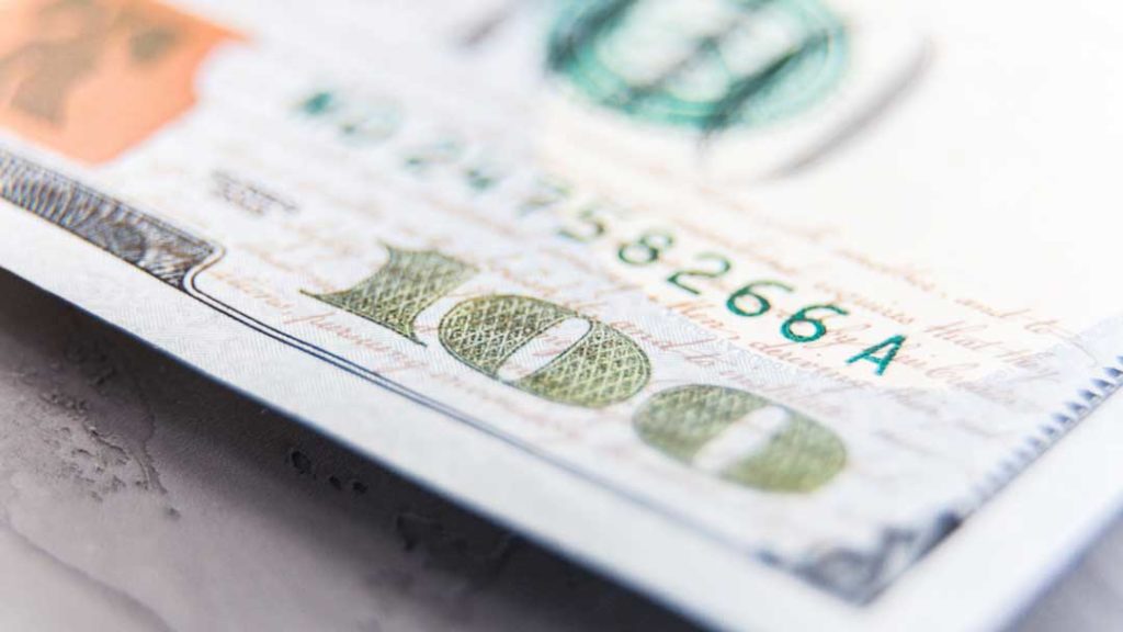 on hundred dollar bill insurance cost concept